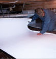 Lizella insulation being installed in a crawl space.